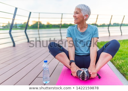 Stockfoto: Portrait Of Smiling Senior Woman Relaxing After Exercising