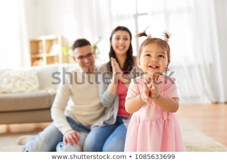 ストックフォト: Baby Girl With Parents Clapping Hands