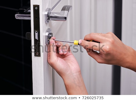 Stock fotó: Repairman Fixing Door