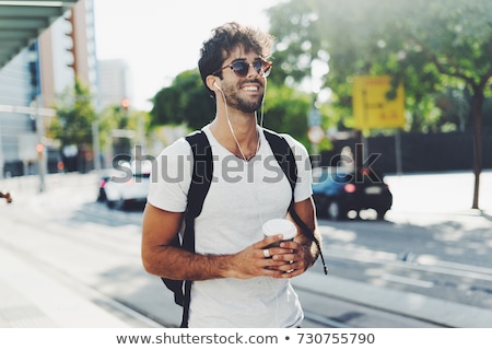 Stock fotó: Portrait Of A Happy Young Man With Curly Hair