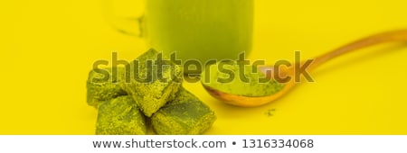 [[stock_photo]]: Green Tea Latte With Ice In Mason Jar And Straw On Yellow Background Homemade Iced Matcha Latte Tea