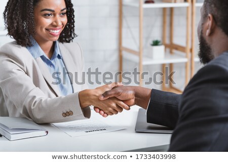 Stock photo: Manager Shaking Hand With Female Candidate During Interview