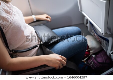 Zdjęcia stock: Nervous Woman Holding Armrests Tight