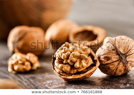 Stok fotoğraf: Walnut Kernels In Bowl On Rustic Wooden Background