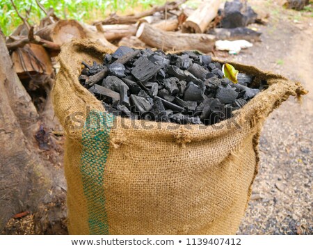 Stockfoto: Burning Charcoal Pile In The Forest