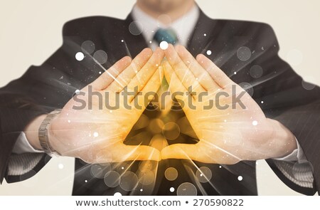 Stock photo: Hands Creating A Form With Yellow Shines