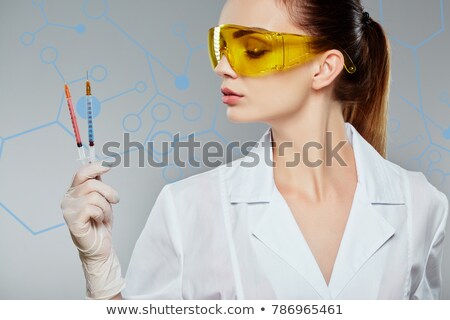 ストックフォト: Beautiful Girl Holding Syringes