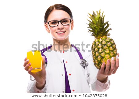 Zdjęcia stock: Female Nutritionist Hold Pineapple And Glass Of Fresh Juice In Her Hands On White Background