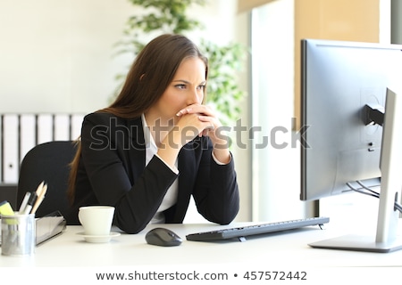 Stock photo: Shocked Businesswoman Looking At Desktop