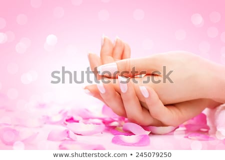 Stok fotoğraf: Manicure Hands Spa Beautiful Woman Hands Soft Skin Beautiful Nails With Pink Rose Flowers Petals