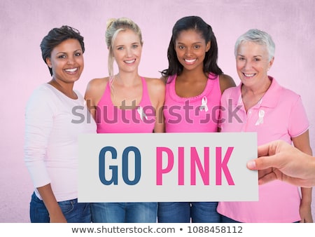 Foto stock: Go Pink Text And Pink Breast Cancer Awareness Women Holding Card