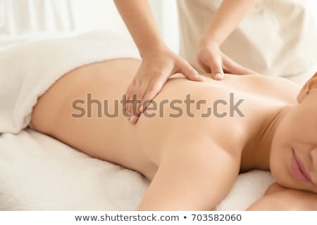 Stok fotoğraf: Woman Lying And Having Back Massage At Spa