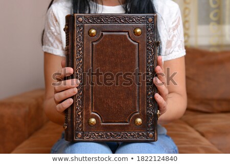 ストックフォト: A Businessman In A Suit And Jeans Holding Book