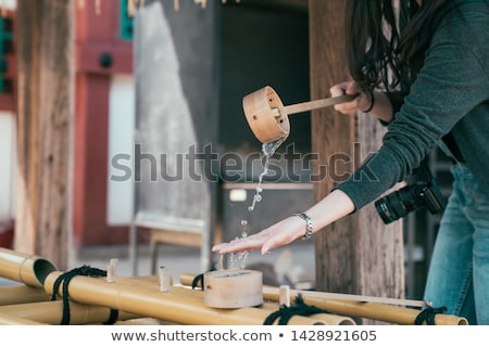 ストックフォト: Woman Praying In Buddhist Temple