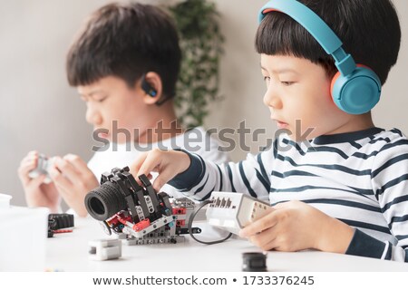 Foto d'archivio: Two Smart Students Programming A Robot