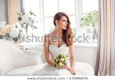 [[stock_photo]]: Beautiful Bride Against A Big Window Indoors