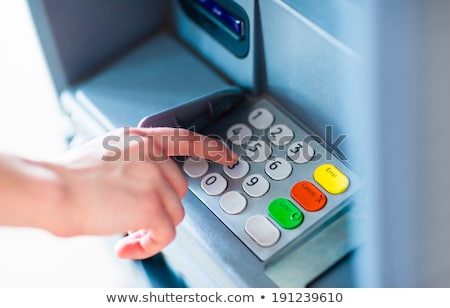 [[stock_photo]]: Hands Typing Pin At Atm Machine