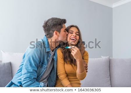 Stockfoto: Happy Smiling Woman Holding And Showing Positive Home Pregnancy