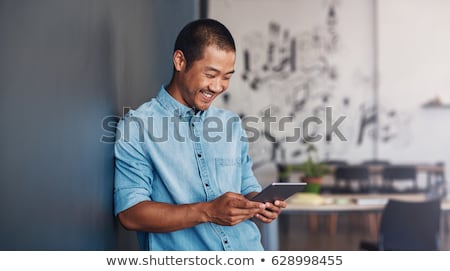 Foto stock: Looking At The Digital Tablet