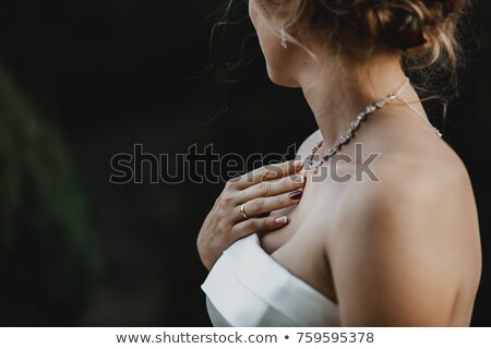 [[stock_photo]]: Bride Looking At Wedding Ring