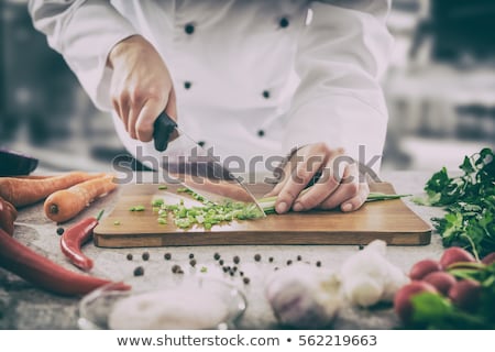 Foto stock: Chef Cooking In A Kitchen