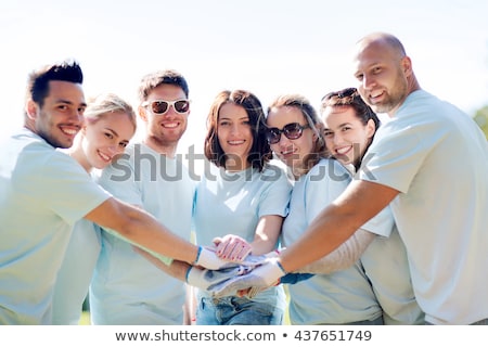 Zdjęcia stock: Group Of Volunteers Putting Hands On Top In Park