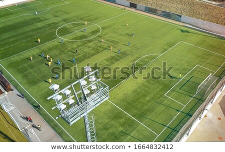 Stockfoto: Aerial View Of A Soccer Pitch With People Playing Soccer On It