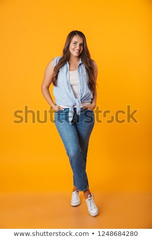 Stock foto: Happy Young Overweight Woman Standing Isolated