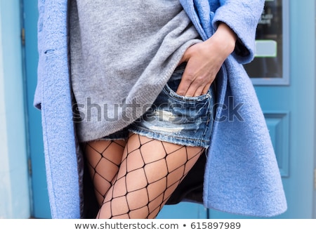 ストックフォト: Beautiful Girl With Fishnet Tights On Hand