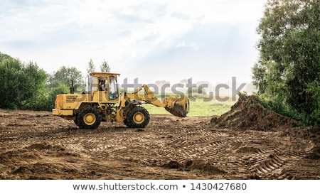 Stock photo: Large Earth Mover Digger Clearing Land