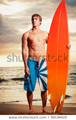 Foto d'archivio: Model With Surfboard On The Beach