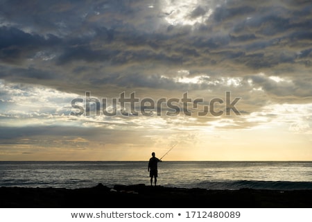 Stockfoto: Fisherman At The Sunset