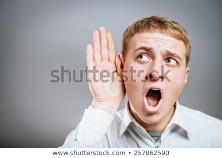 Stok fotoğraf: Businessman Trying To Listen Isolated On White Background