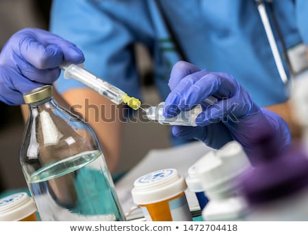 Stockfoto: Nurse Preparing Iv Drip