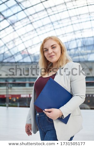 Stok fotoğraf: Pretty Blonde Smiling At Price Of Jacket