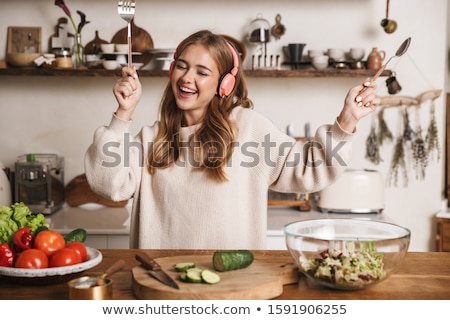 [[stock_photo]]: Woman Dancing While Listening Music On Headphone