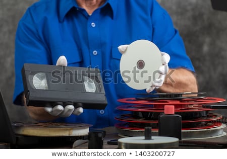 Stockfoto: Analog Video Cassette With Dvd Disc