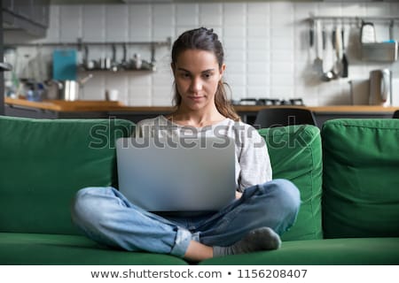 Stockfoto: Female Blogger Typing Blog Post On Laptop Computer