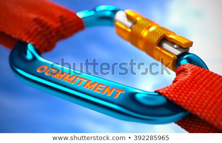 Stok fotoğraf: Commitment On Blue Carabiner Between Red Ropes