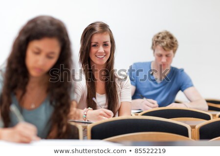 Foto stock: Three Young Women In Lecture Theatre