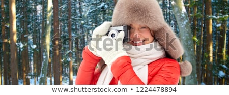 Stock fotó: Happy Woman With Film Camera Over Winter Forest