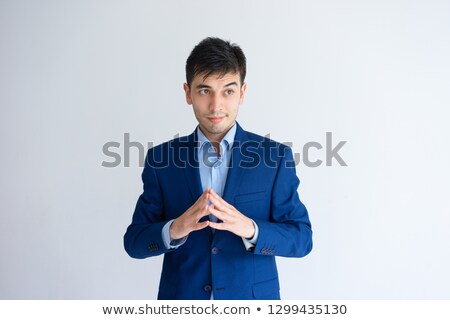 Stok fotoğraf: Contemplating Businessman Holding Fingers Together In Front