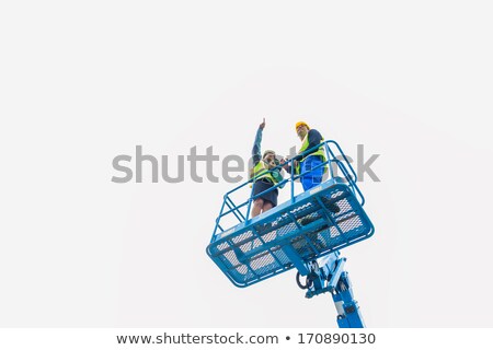 Stock photo: Construction Workers On Site In Hydraulic Lifting Ramp