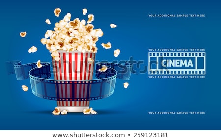 [[stock_photo]]: Jumping Popcorn And Movie Film Tape