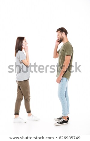 Foto stock: Young Attractive Caucasian Couple Calling Mobile