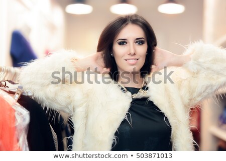 ストックフォト: Shopping Woman Dressed In White Fur Coat In Fashion Store