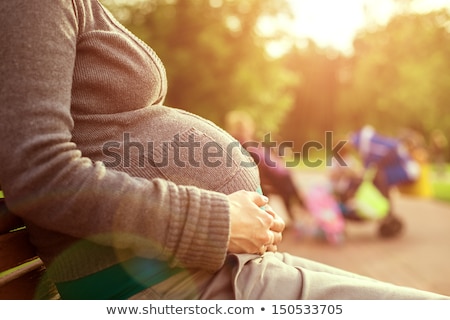 Stock foto: Pregnant Woman Outdoors In Park