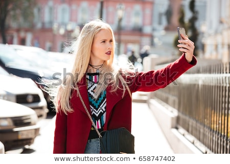 Zdjęcia stock: Amazing Young Blonde Lady Walking Outdoors Looking Aside