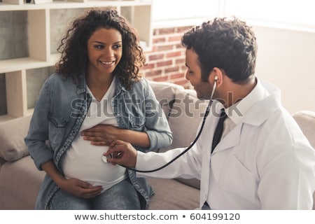 ストックフォト: Young Pregnant Woman At Doctors Office