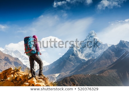 Stock photo: Woman Backpacker Climbing With Backpack In Himalayas Nepal